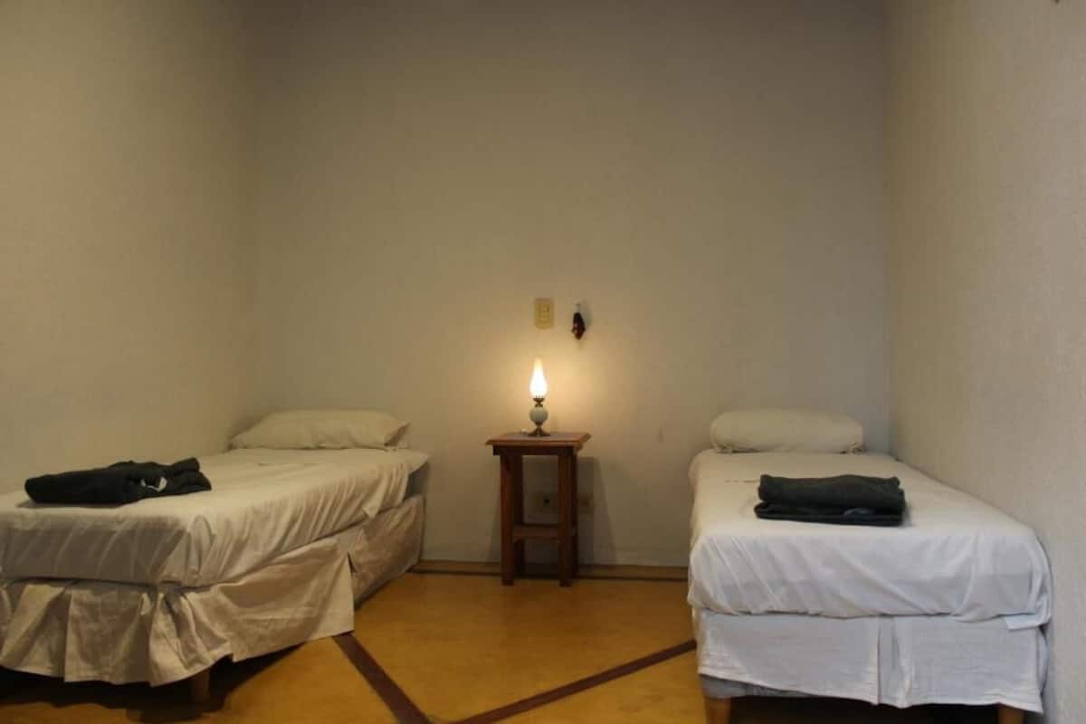 Twin room, 2 beds with shared bathroom. No window