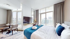 Apartment, 1 Bedroom, Pool Access | Living area | 55-inch Smart TV with digital channels