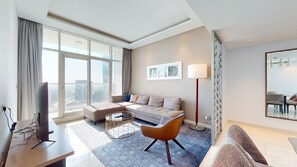 Apartment, 2 Bedrooms, Pool Access | Living area | 55-inch Smart TV with digital channels