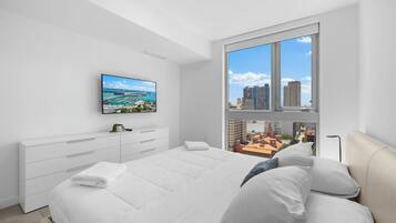 Deluxe Condo, Balcony, City View | 1 bedroom, premium bedding, blackout curtains, iron/ironing board