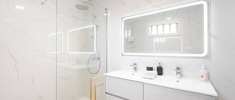 Shower, hair dryer, towels, soap