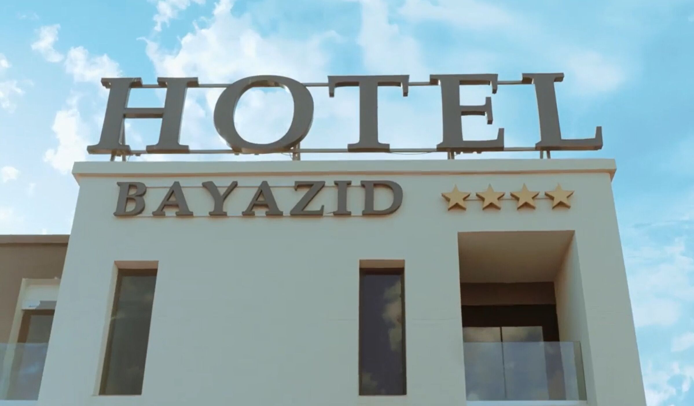 A hotel sign with the name "BAYAZID" and four stars.