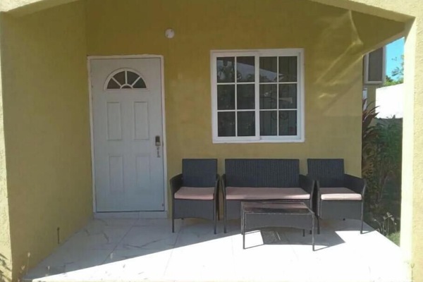 Front entrance with patio seating