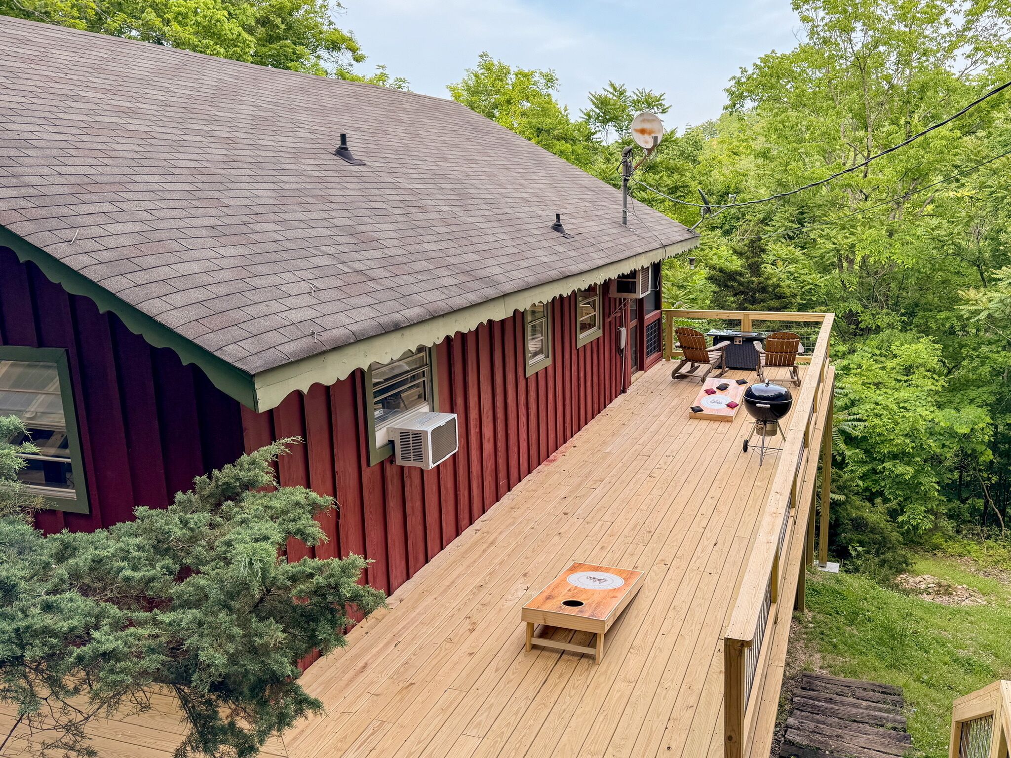Enjoy the view, play a game of cornhole, or grill on the side porch
