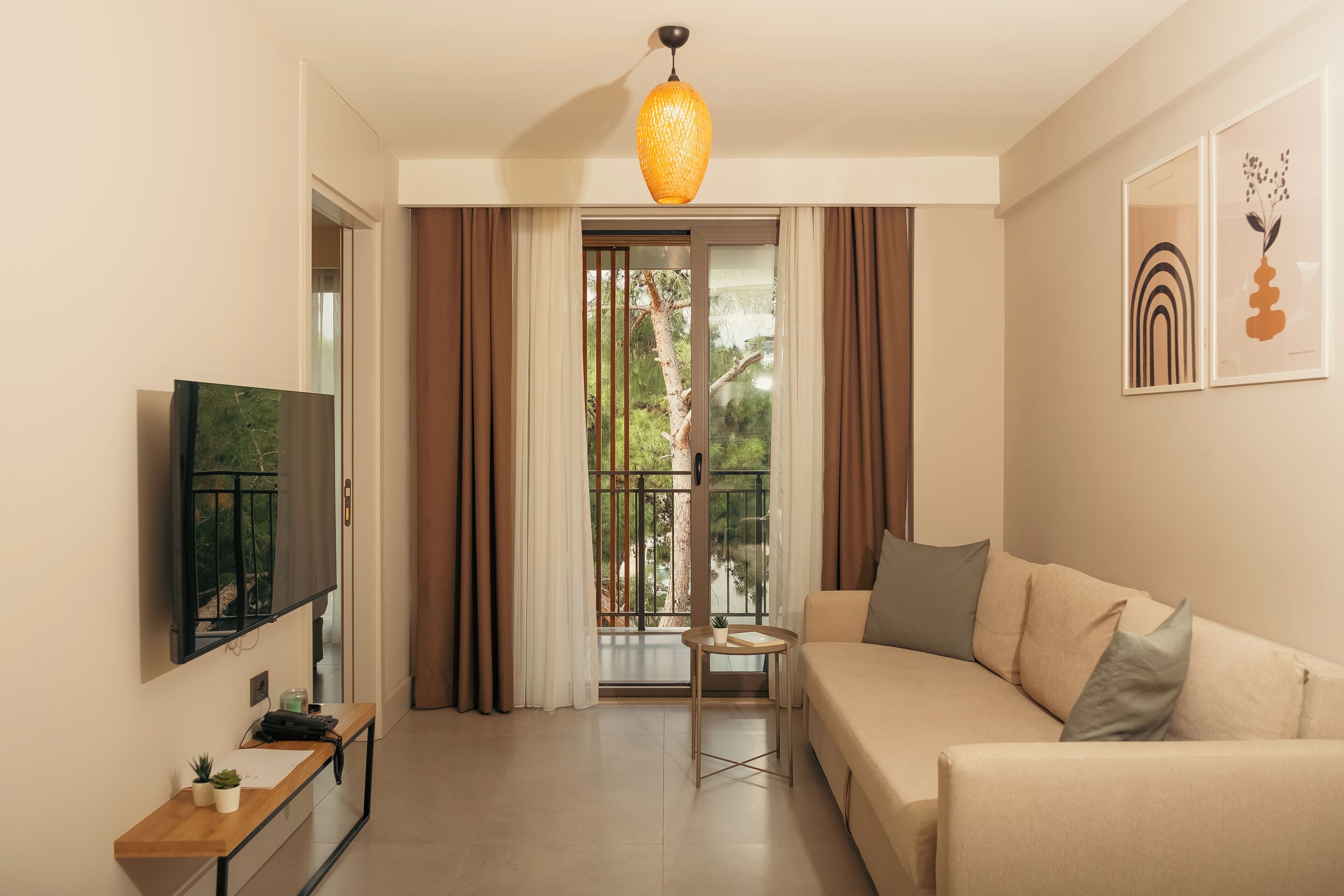 Deluxe Suite, Balcony | Living area | TV, heated floors
