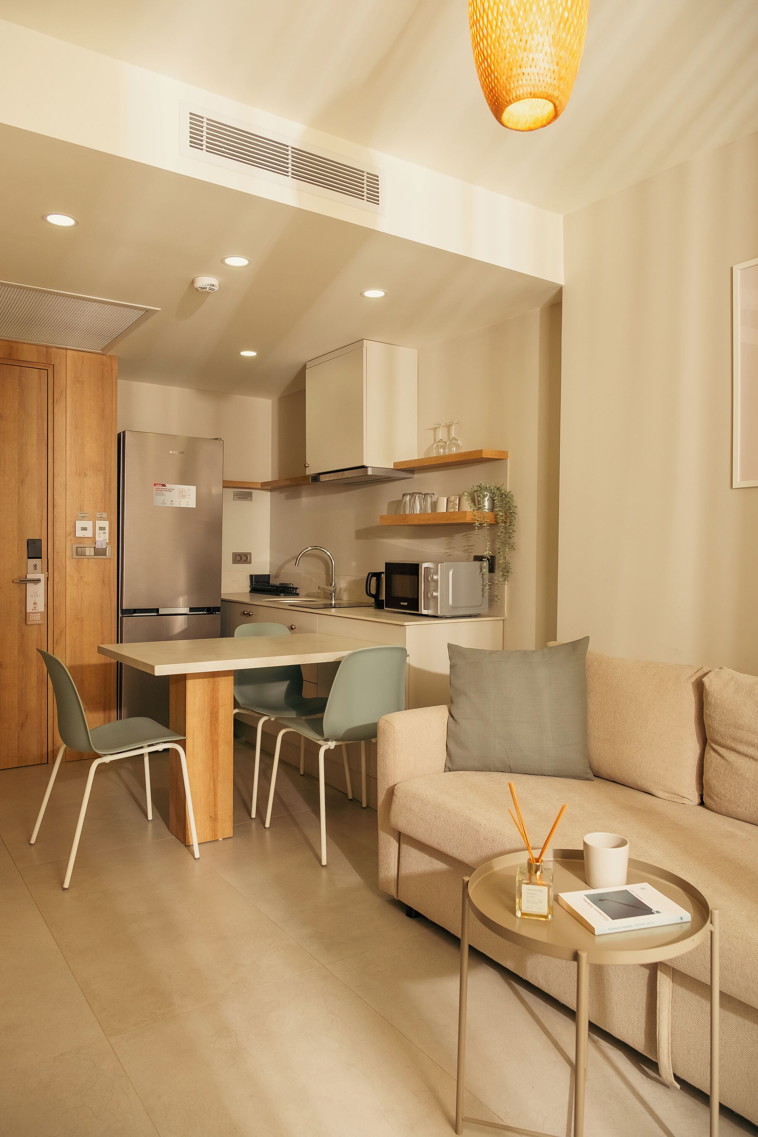 Deluxe Suite | Living area | TV, heated floors