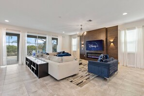 TV, fireplace, video games - Luxury Villa 9 Bdrm/Pool/Games Room at Solara Resort (Kissimmee)