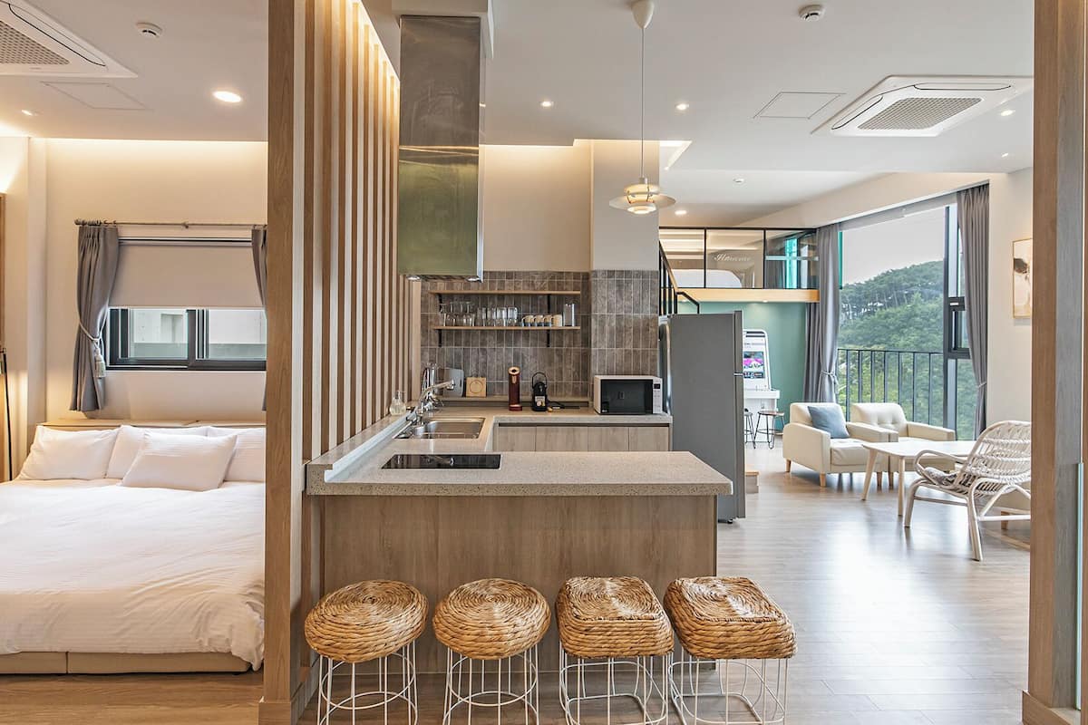 A, Room 202 [in-room Pool fee 50,000KRW, Duplex, Projector, Netflix, Mini Arcade Machine, Couple] | Living area | 50-inch LCD TV with cable channels, Netflix, toys