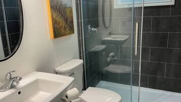 Shower, eco-friendly toiletries, hair dryer, towels