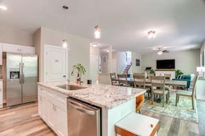 Enjoy meals in this well-equipped kitchen with a double sink and stainless steel appliances.