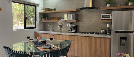 Fridge, microwave, stovetop, coffee/tea maker