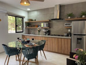 Fridge, microwave, stovetop, coffee/tea maker