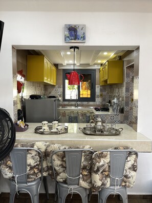 Fridge, microwave, stovetop, coffee/tea maker