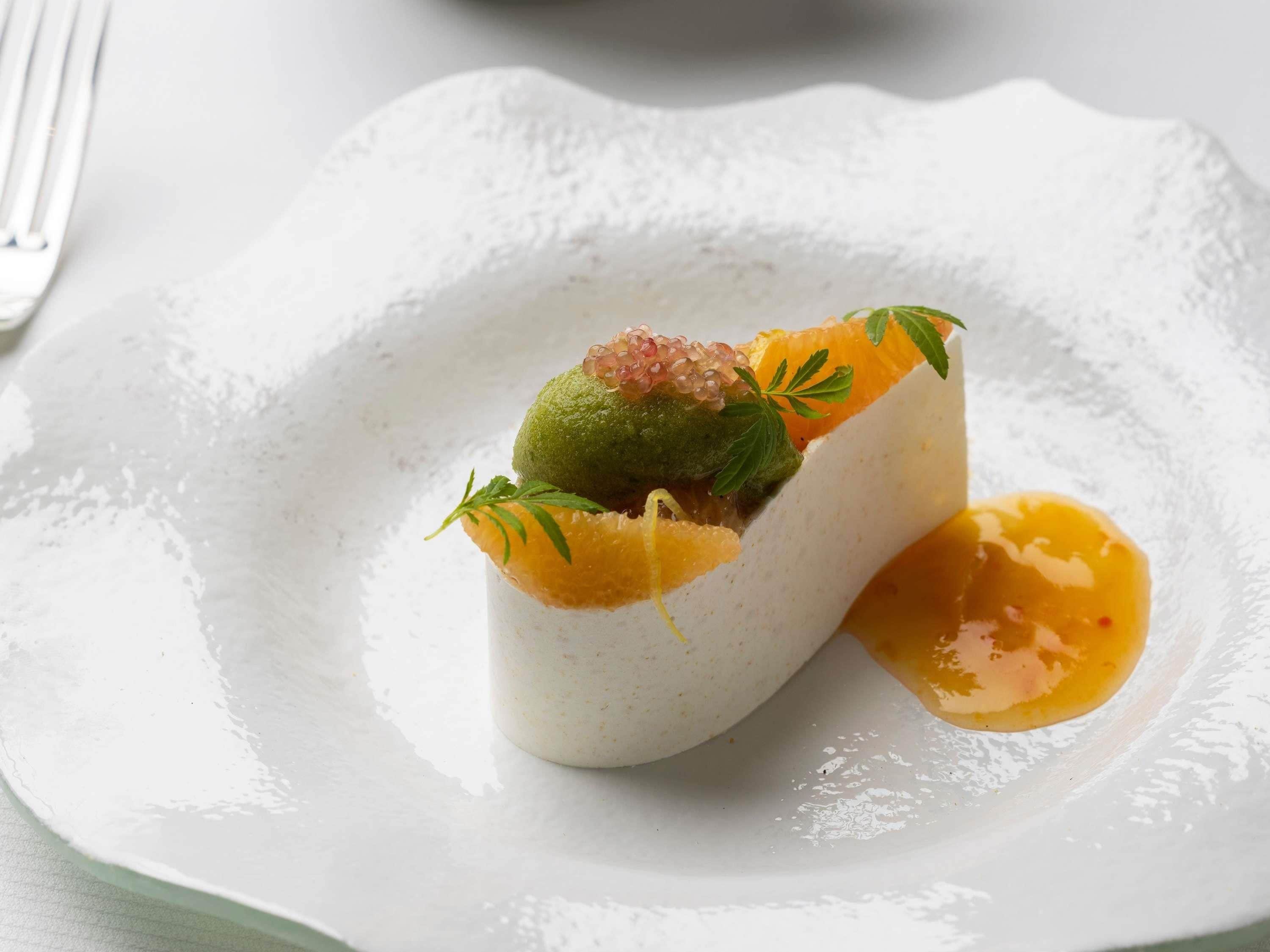 A dessert on a white plate with a fork on the side.