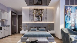 Ein modernes Schlafzimmer mit einem großen Bett, Nachttischen, einer Couch und einem Sessel.