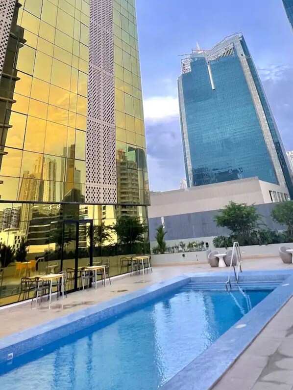 Experience the city from a unique perspective with a rooftop pool overlooking the urban landscape.