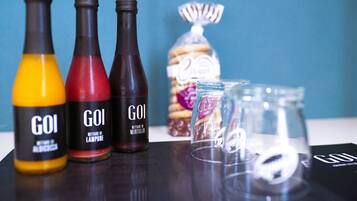 Three bottles labeled "GOI" with a clear label and a glass jar with a label partially visible.