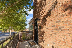 Welcome to 1469, a charming residence with an entrance and a serene outdoor setting.