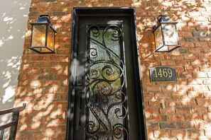 Stunning brick building with a black metal door and ornate details, situated on Regent Park Road.