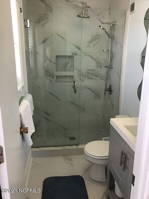 Shower, towels, soap, toilet paper