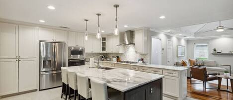 Fridge, stovetop, dishwasher, coffee/tea maker