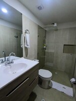 Deluxe Suite, City View | Bathroom | Shower, towels, soap, shampoo