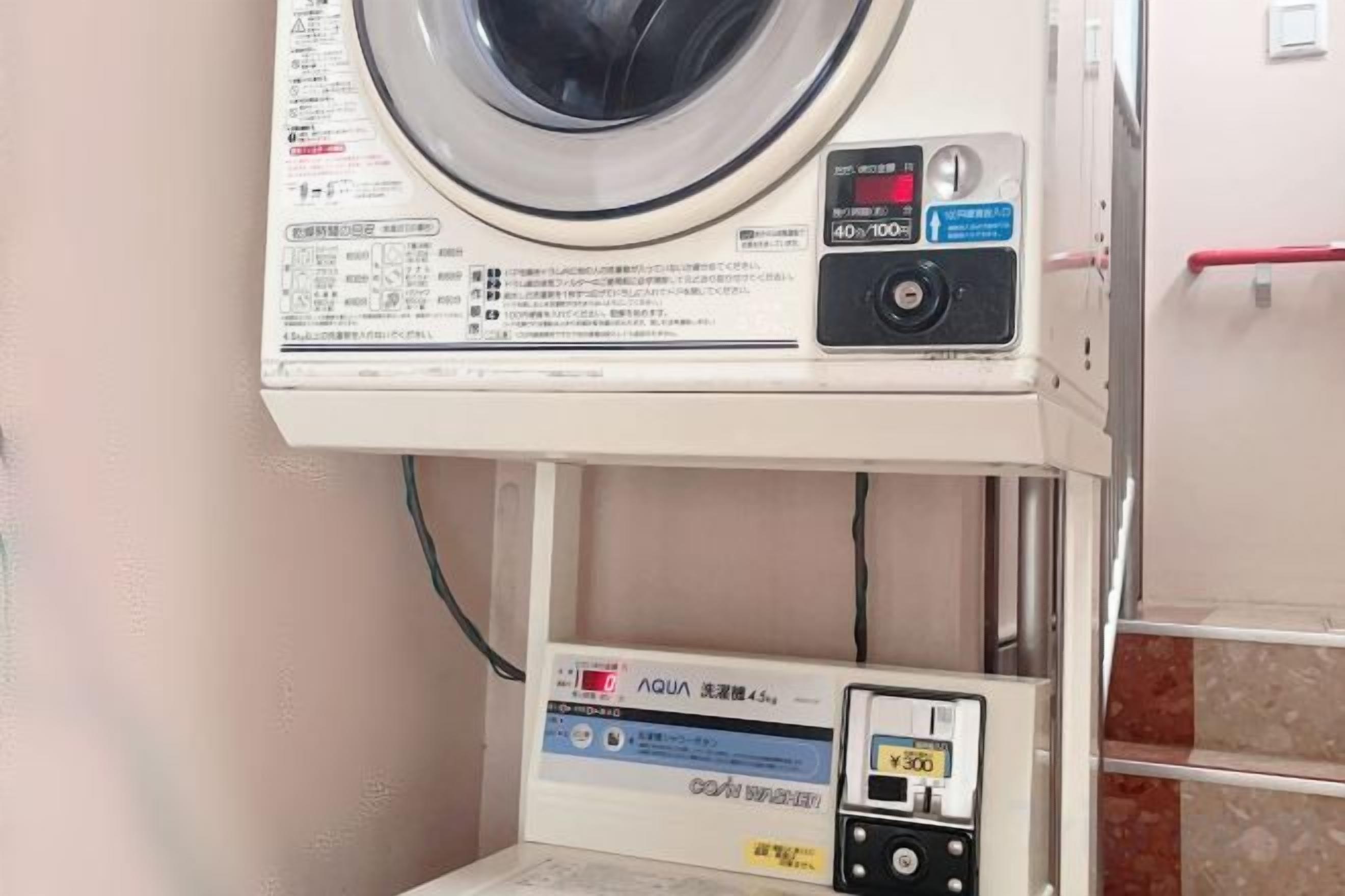 A washing machine with a control panel and a digital display.