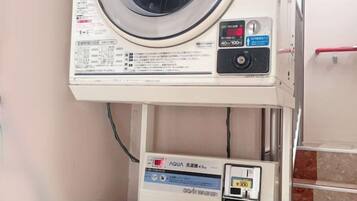 A washing machine with a control panel and a digital display.