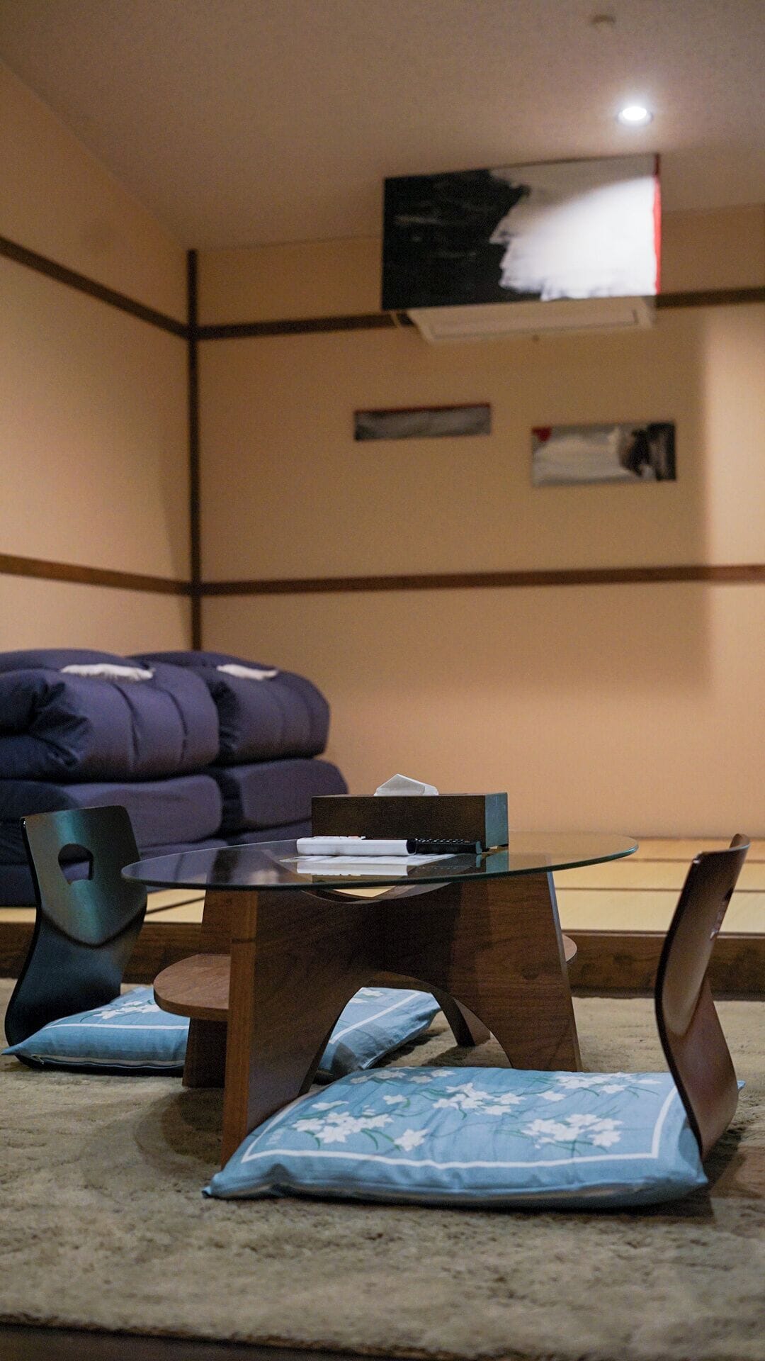 A living room with a sofa, a coffee table, and a chair.