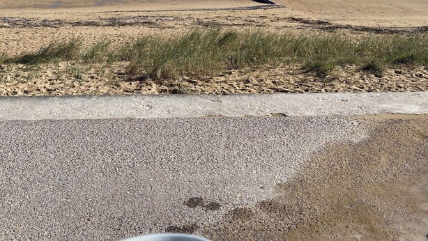 A beach view with a concrete path and a white mug in the foreground. - 100m from the beach! (Hermanville-sur-Mer)