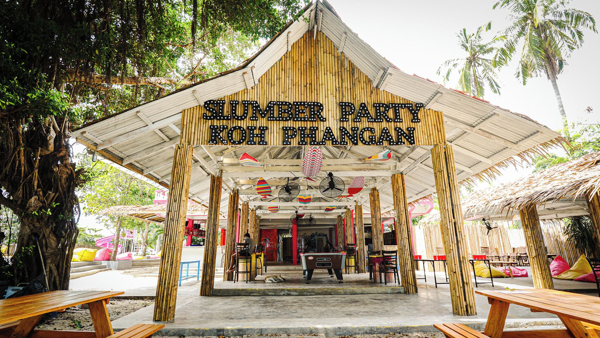 A covered outdoor area with a sign reading "SUMMER PARTY KOH PHANGAN".