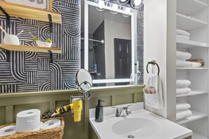 Shower, hair dryer, towels, soap