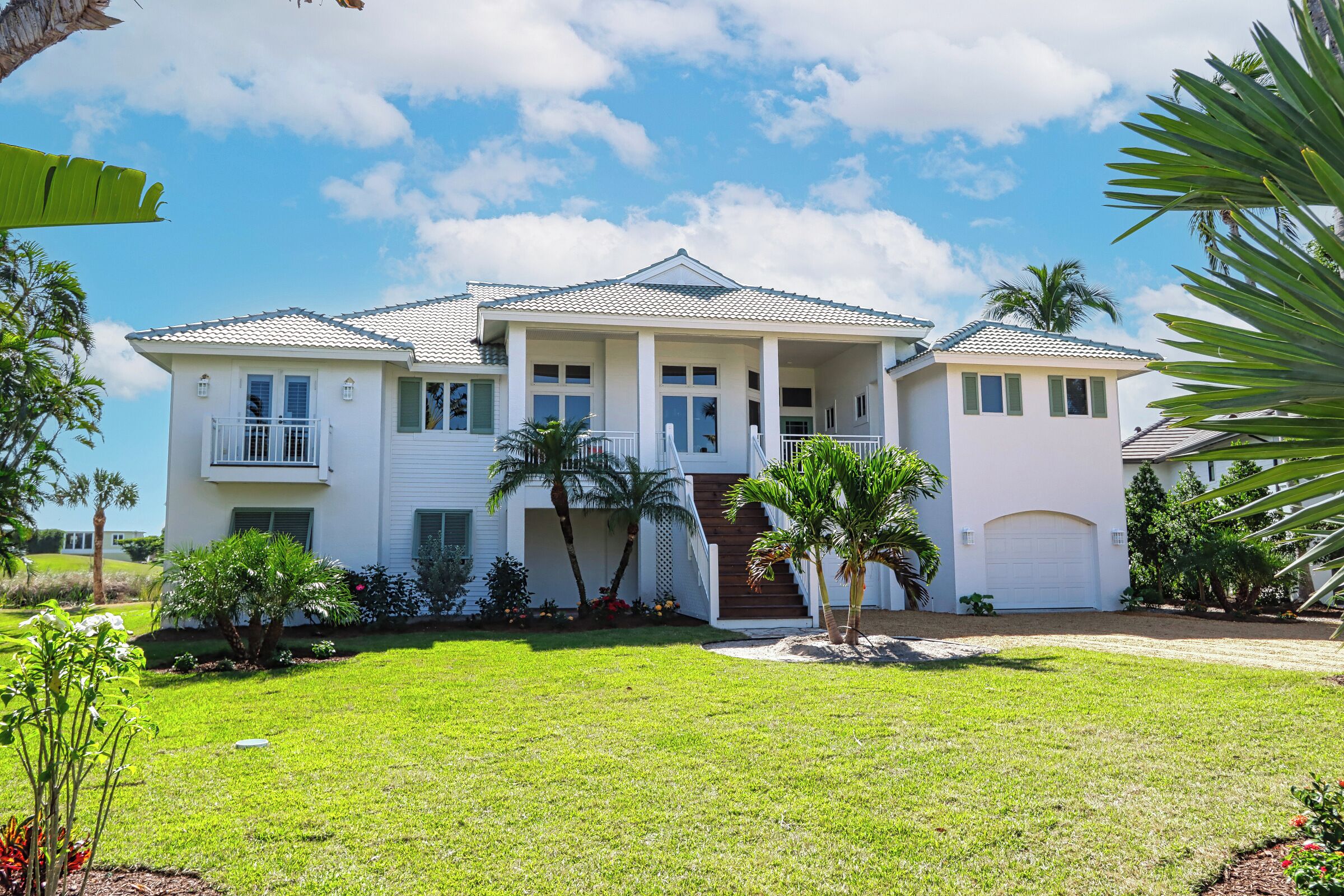 Exquisite river-view home with heated pool and spa in the expansive lanai