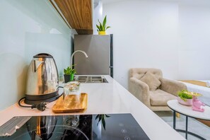 Ground Floor Comfort Double Room | Private kitchenette | Full-sized fridge, stovetop, electric kettle - SpringHill Apartment - The High Class (Ho Chi Minh City)
