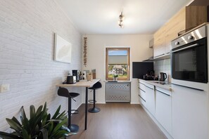 Réfrigérateur, four, plaque de cuisson, lave-vaisselle