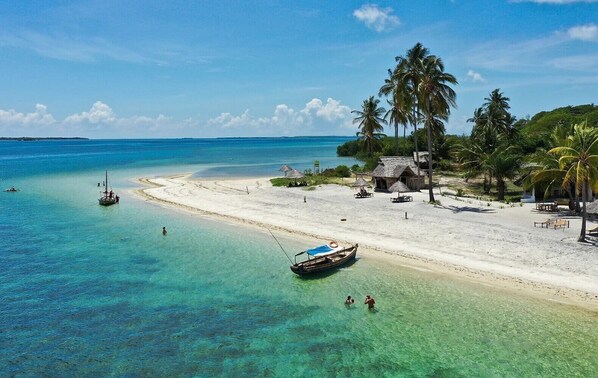 Private beach, white sand, sun loungers, beach umbrellas