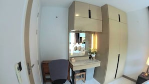 A compact bedroom with a bed, a desk, a chair, a wardrobe, and a mirror. - B305 - 1 Bedroom Condo Pool View Near Ao Nang Beach (Krabi)