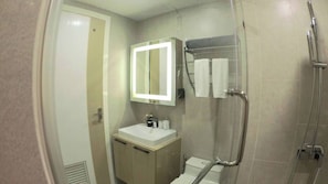 A modern bathroom with a glass shower enclosure, a vanity with a mirror, and a toilet. - B305 - 1 Bedroom Condo Pool View Near Ao Nang Beach (Krabi)