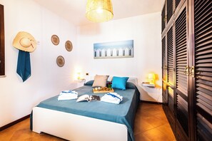 Departamento familiar, varias habitaciones (Residence I Mirti n. 8) | 1 habitación y ropa de cama 