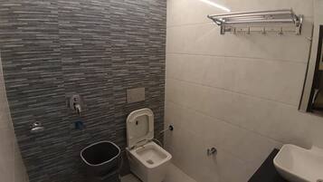 Shower, rainfall showerhead, towels, soap