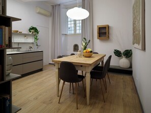 A modern kitchen with a dining area. - Vintage Romance Patio Apt by Oteego (Florence)