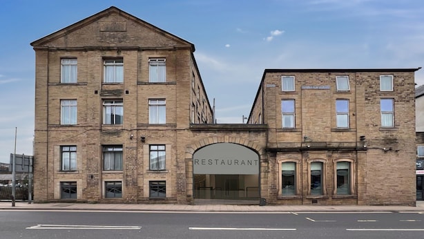A two-story brick building with a central entrance labeled "RESTAURANT". - Cambridge Hotel Waterfront (Brighouse)