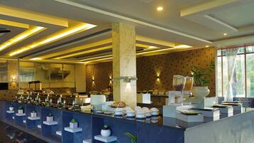A modern hotel lobby with a long reception counter, marble columns, and a patterned wall.