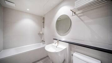 Twin Room | Bathroom | Shower, slippers, towels