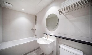 Twin Room | Bathroom | Shower, slippers, towels