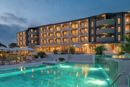 2 outdoor pools, pool umbrellas, pool loungers. Molum Hotel & Residences