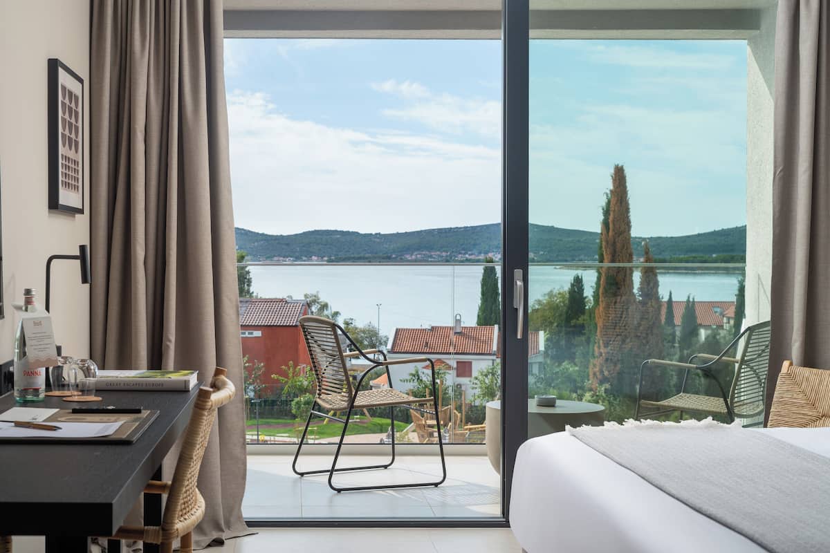 Deluxe Double Room, Balcony, Sea View | 1 bedroom, in-room safe, desk, blackout curtains