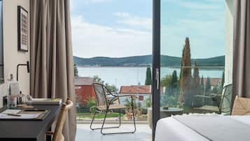 Deluxe Double Room, Balcony, Sea View | 1 bedroom, in-room safe, desk, blackout drapes