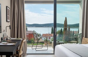 Deluxe Double Room, Balcony, Sea View | In-room safe, desk, blackout drapes, iron/ironing board