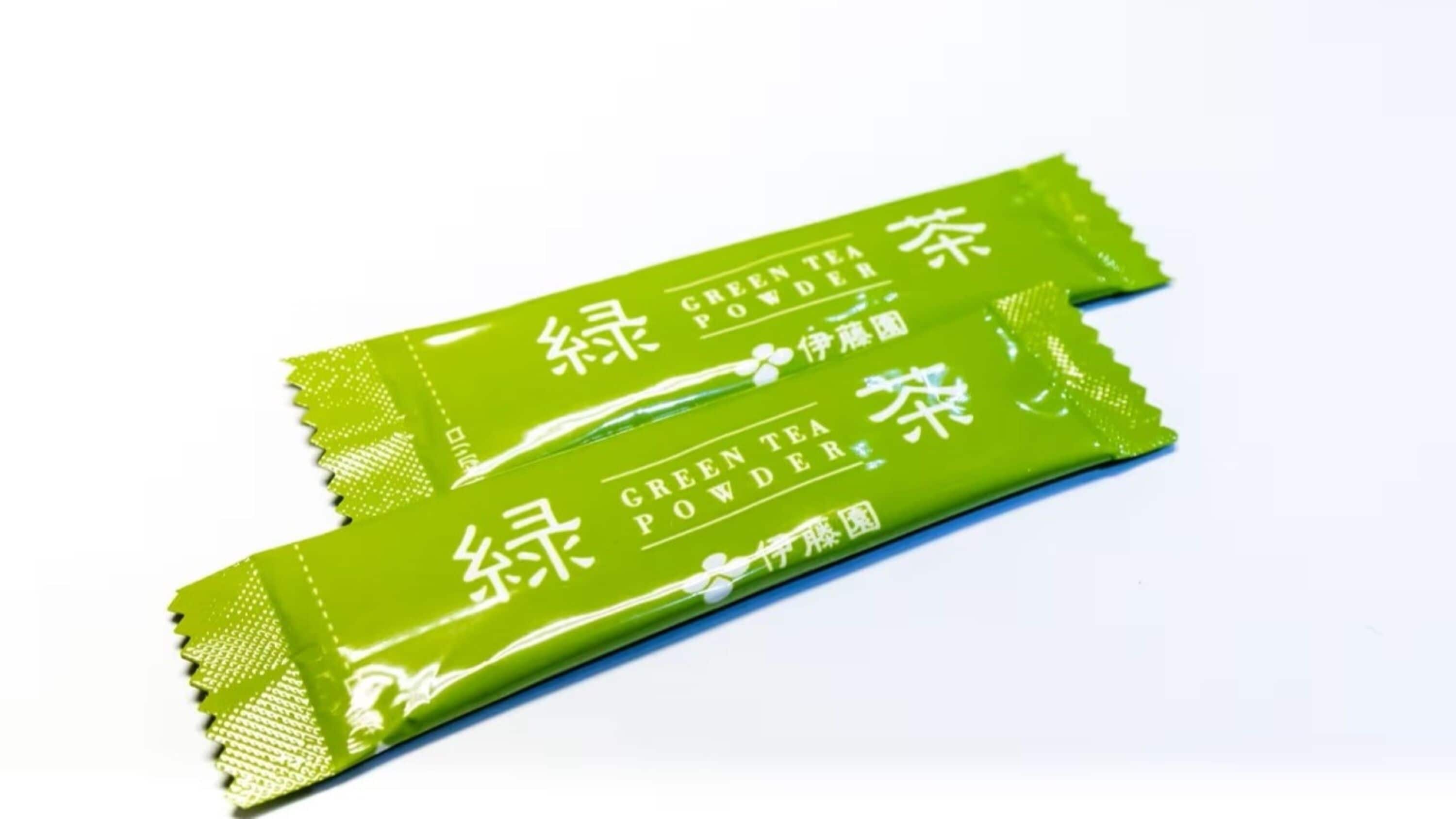 Two packets of green tea powder.